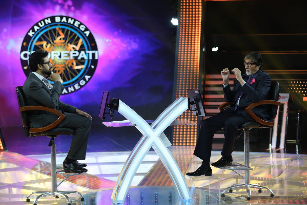 Abhishek Bachchan with Amitabh Bachchan on KBC 9